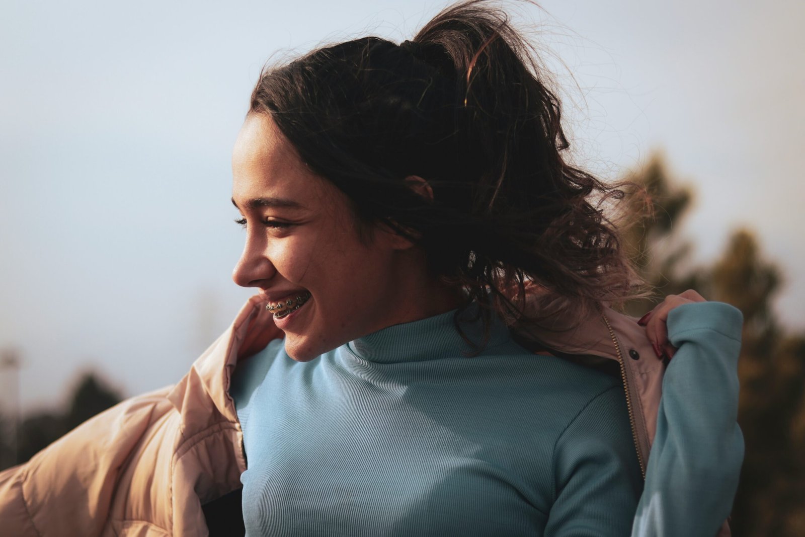 a woman with her hair in the wind